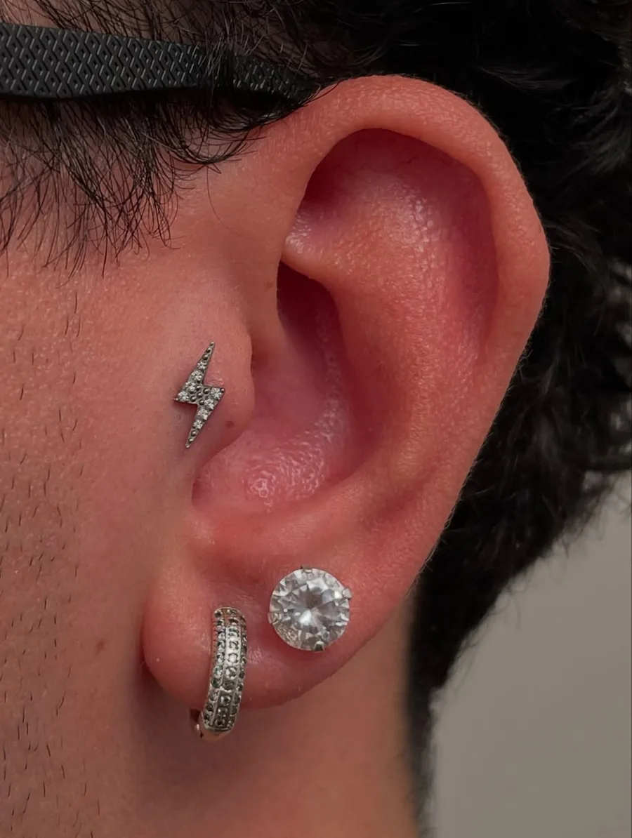Ear stack with a round stud, iced huggie hoop and lightning bolt stud