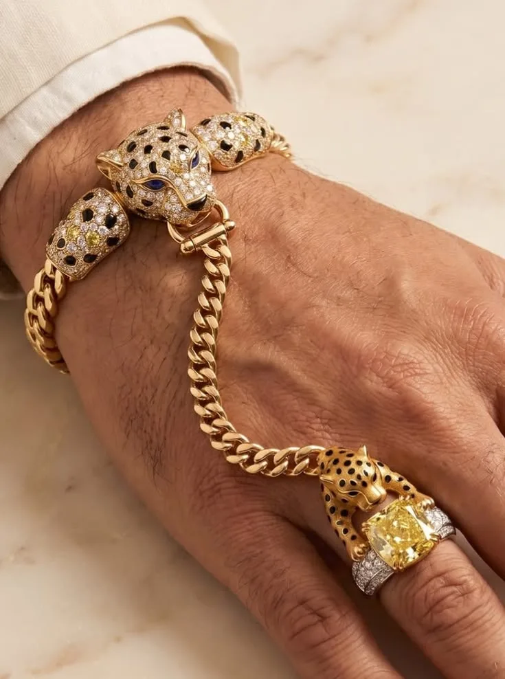 Gold hand chain bracelet with matching ring and yellow stone