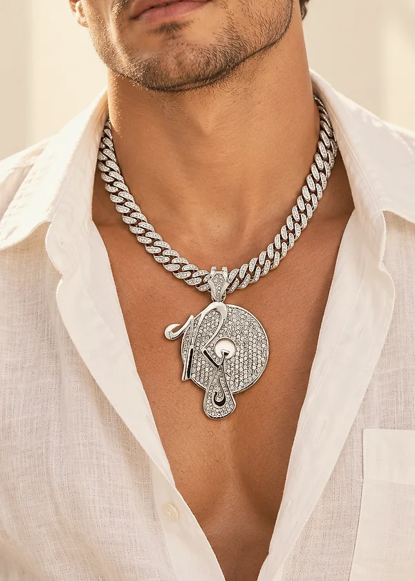 Iced Cuban chain with a custom pavé pendant over an open linen shirt
