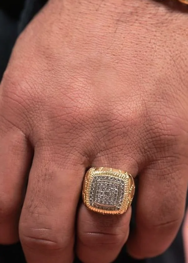Iced square signet ring on a man’s hand