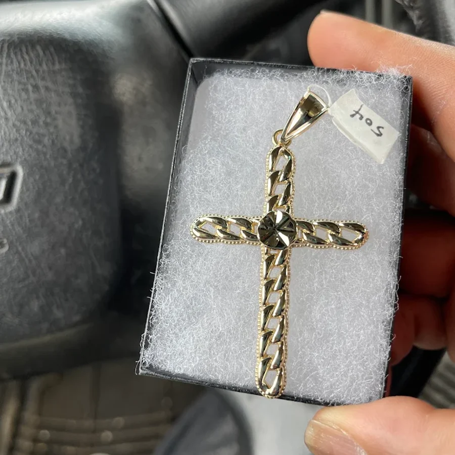 Gold Cuban-link cross pendant in a gift box