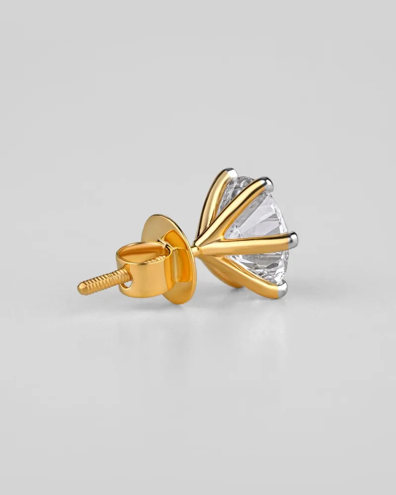 Single yellow gold diamond stud showing its screw back post